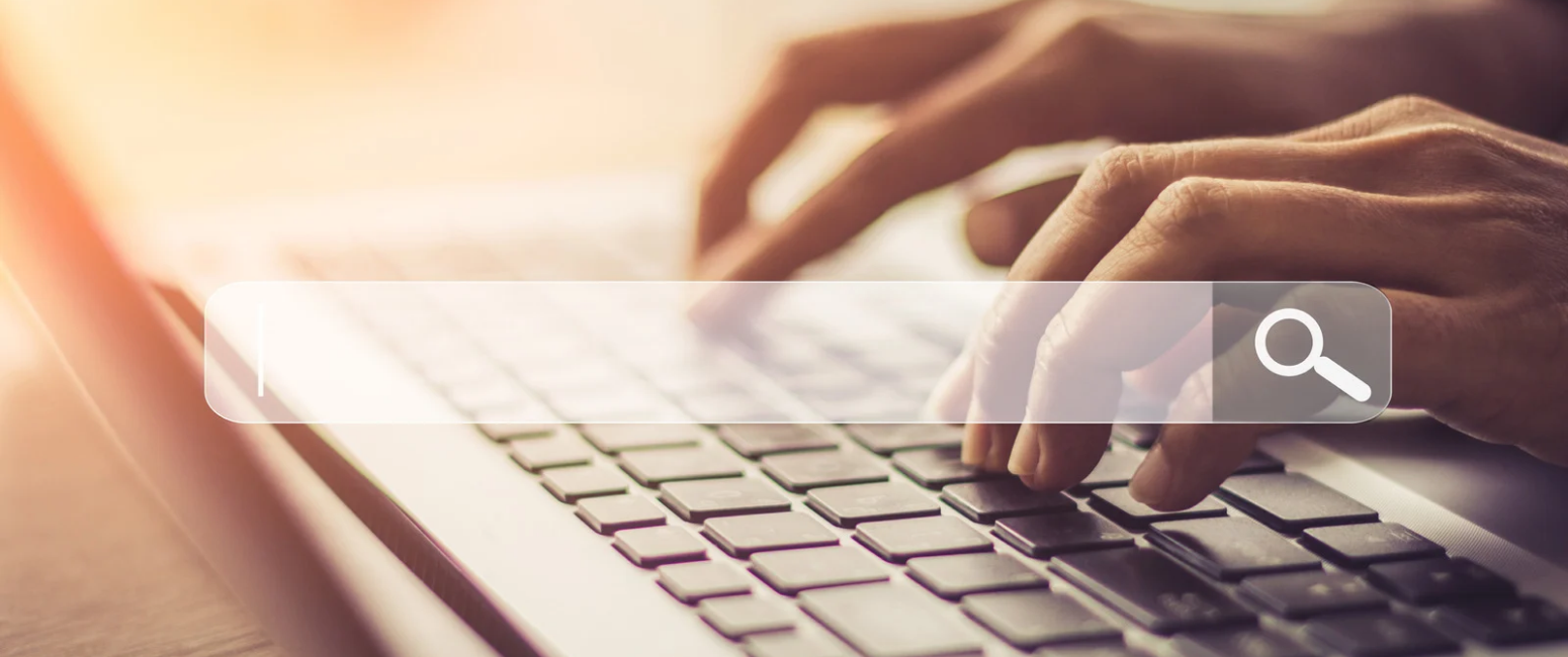 Person typing on keyboard doing an Internet search
